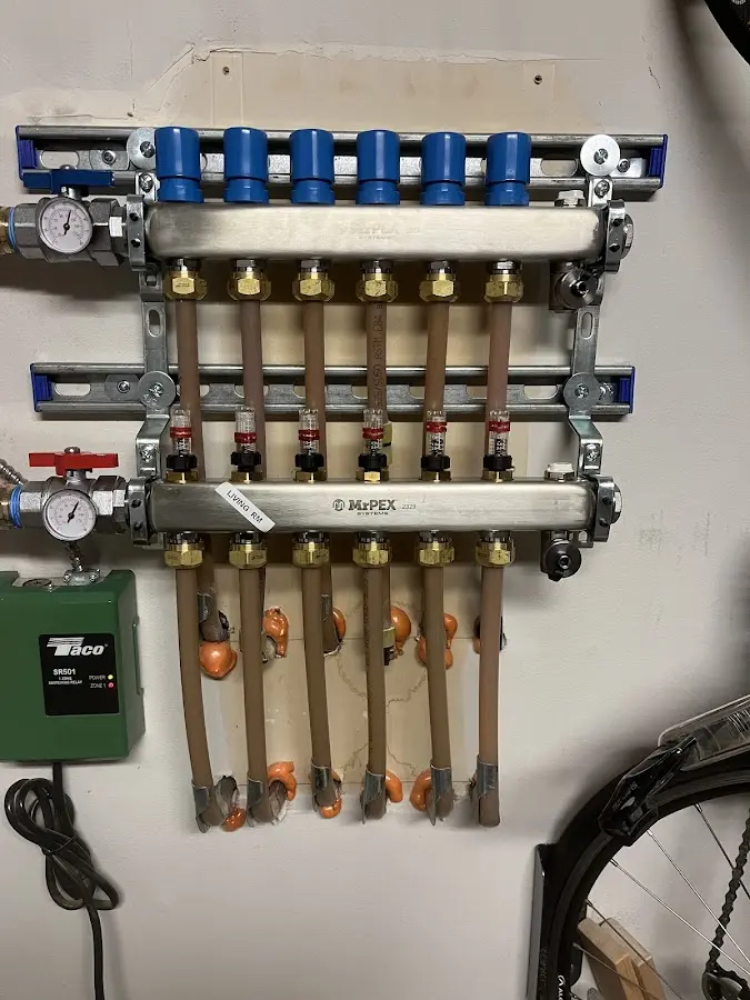 Plumber performing Gas Line Installation at a residential property in Fair Lakes